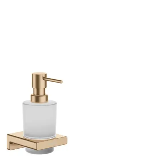 Hansgrohe Lotionspender aus klarem Glas mit einer Pumpe in Brushed Bronze, befestigt auf einer rechteckigen Halterung, die an der Wand montiert ist.